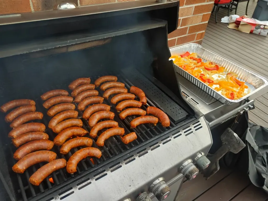 Ricci's hot sausage coiled on the grill