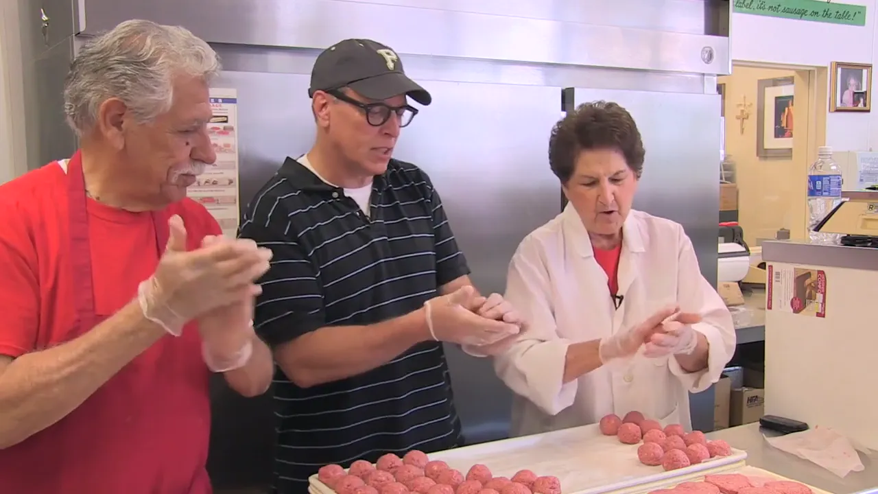 Meatballs being rolled by hand at Ricci’s