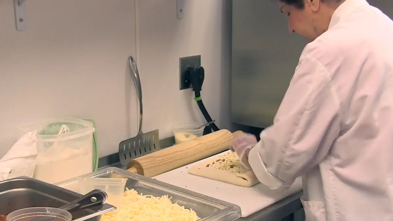 Sausage rolls being made by hand at Ricci’s